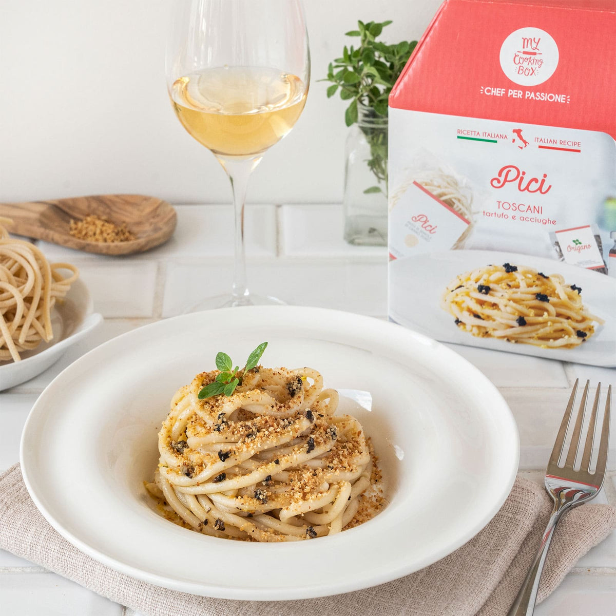 Pici pasta with truffles, breadcrumbs and anchovies